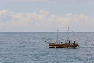 With fishing boats fishing close to shore