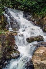 Naklejka premium The stream of water between the rocks in the mountains Sri Lanka