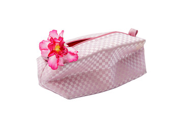 Fashion bag and pink flowers isolated on white background