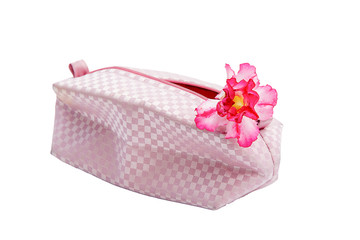 Fototapeta na wymiar Fashion bag and pink flowers isolated on white background
