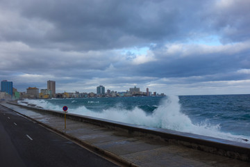 Stormy weather with big waves crashing over the seawall of The Malecon, the famous Havana...