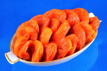 Dried apricots - dried halves of apricot fruit without seeds. Dried apricots are popular in cooking, sweet dried fruit, healthy food, compote making.