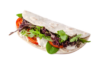 The concept of Italian cuisine. Vegatarian piadina with tomatoes, mozzarella cheese, mix lettuce, arugula and sauce on a white background. Isolate