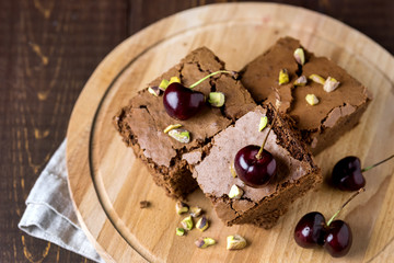 Tasty Homemade Dessert Chocolate Brownie Decorated with Berry and Nuts on Wooden Tray Homemade Dessert Horizontal