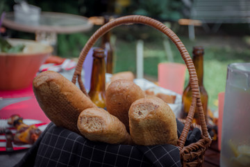 Bread in basket place on the table for partying or picnic.