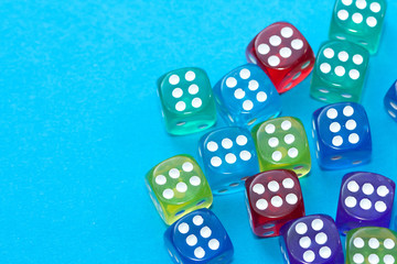 Colorful dices on blue background