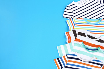 Baby clothes on blue background