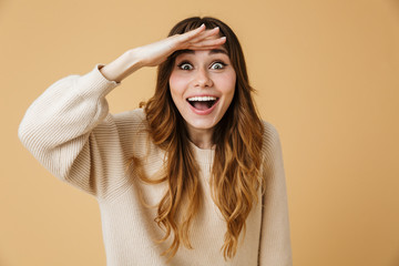 Beautiful young woman wearing sweater standing