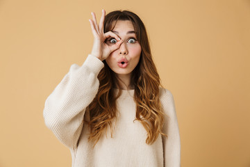 Beautiful young woman wearing sweater standing