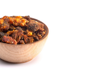 Sweet Myrrh Opoponax in a Wooden Bowl Isolated on a White Background