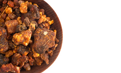 Sweet Myrrh Opoponax in a Wooden Bowl Isolated on a White Background