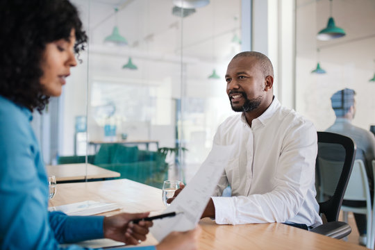 Job applicant smiling during an interview in an office