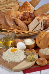 bakery products,bakery products in wicker basket,spilled flour and broken egg on cutting board