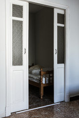 Italian room with the open door with bed