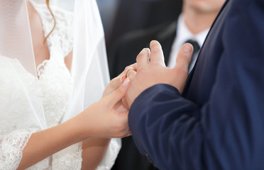 newlyweds hands with wedding rings