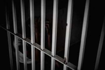 Hands of women desperate to catch the iron prison,prisoner concept,thailand people,Hope to be...