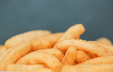 Closeup Shrimp cracker chips on a white paper plate. - Image