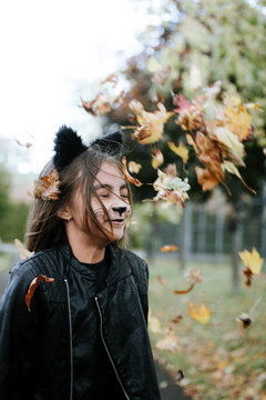 Girl in a cat's costume at Halloween outdoor