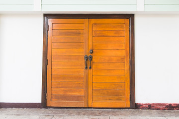 Front, Light Brown Old Wooden Double Doors. with White walls, ..Entrance to Home.