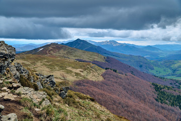 A beautiful panoramic mysterious view of the forest in the Bieszczady mountains (Poland) on a misty rainy spring May day, nature is lonely - without people