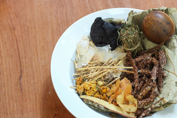 Bowl full of dried Chinese mixed herbs to make cooling drinks. Chinese herbal medicine with ingredient.