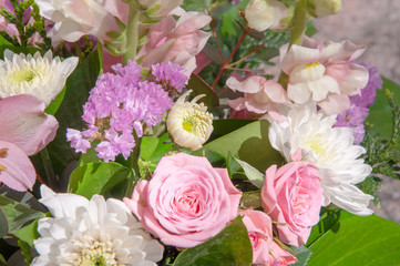 Bouquet of flowers with roses, chrysanthemums and daisies