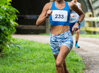 Female runner during 5K in woods