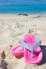 sandals in the sand of the beach