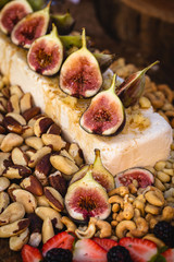 Gourmet natural food. Gourmet parma cheese with caramelized figs. Fruit of high gastronomy, for social events like weddings and parties.