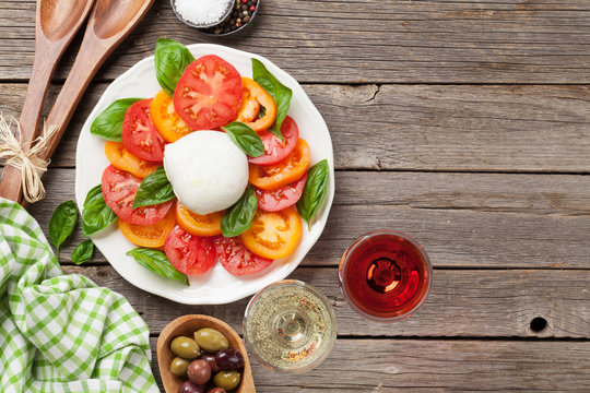 Caprese salad with rose and white wine