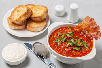 Tomato soup with bacon. European cuisine.