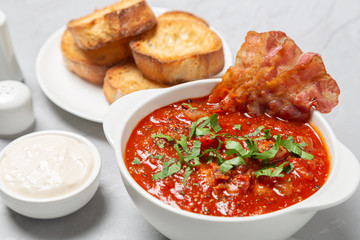 Tomato soup with bacon. European cuisine.
