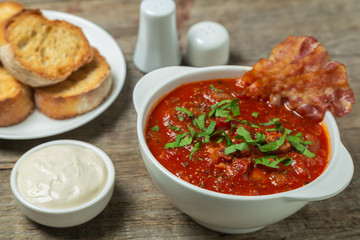 Tomato soup with bacon. European cuisine.