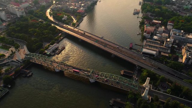 Aerial view of Bangkok downtown,Traffic at the Phra Phuttha Yodfa Bridge and Phra Pok Klao Bridge ,Chao Phraya River In the morning.