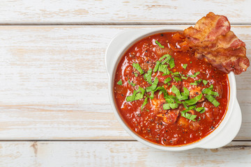 Tomato soup with bacon. The view from the top. Copy-space.