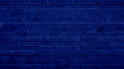 Grunge brick wall blue texture navy blue background.