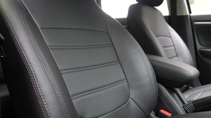Black leather seat covers in the car. beautiful leather car interior design. stylish leather seats...