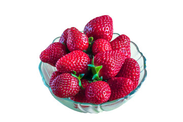 Red ripe garden berry strawberries in deep glass transparent plate, dish, bowl, saucer, bowl, dish, isolate