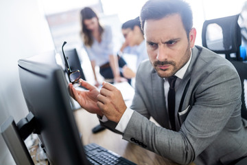 Group of successful business people at work in office