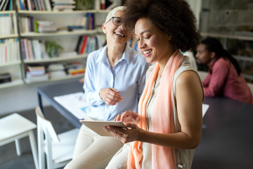 Group of successful business people at work in office