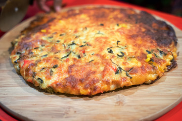 Custom made pizzas at home on appetizing brown wooden trays