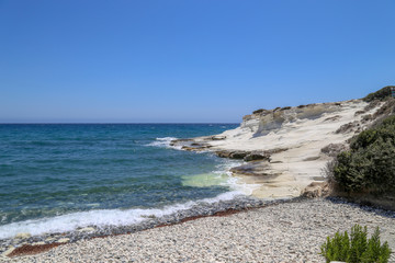 Pebble beach, coast with white rocks In Cyprus, the Mediterranean Sea.