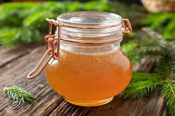 Syrup made from young spruce tips in a jar