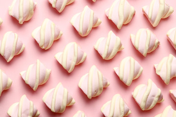 Abstract composition of marshmallows on a pink background. Tov view