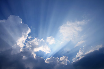 Dark sky with  sun rays and clouds