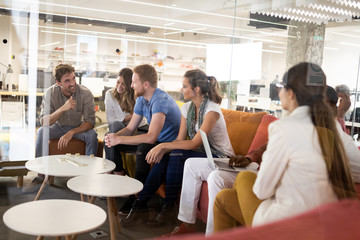 Carefree diverse office workers having fun during work break