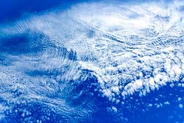 Fantastic white clouds against blue summer sky.