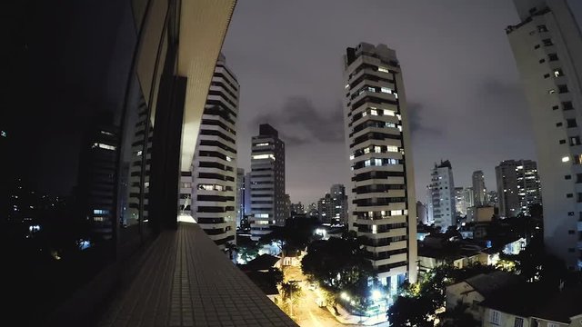 Timelapse video of Sao Paulo at night. Buildings of Sao Paulo city at a cloudy night. Clouds moving fast. Aclimacao residential neighborhood, central area of the city.