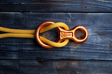 Close up of climbing gear on wooden desk - table top shot