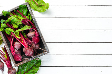 Fresh beet on a white wooden background. Healthy food. Top view. Free space for your text.
